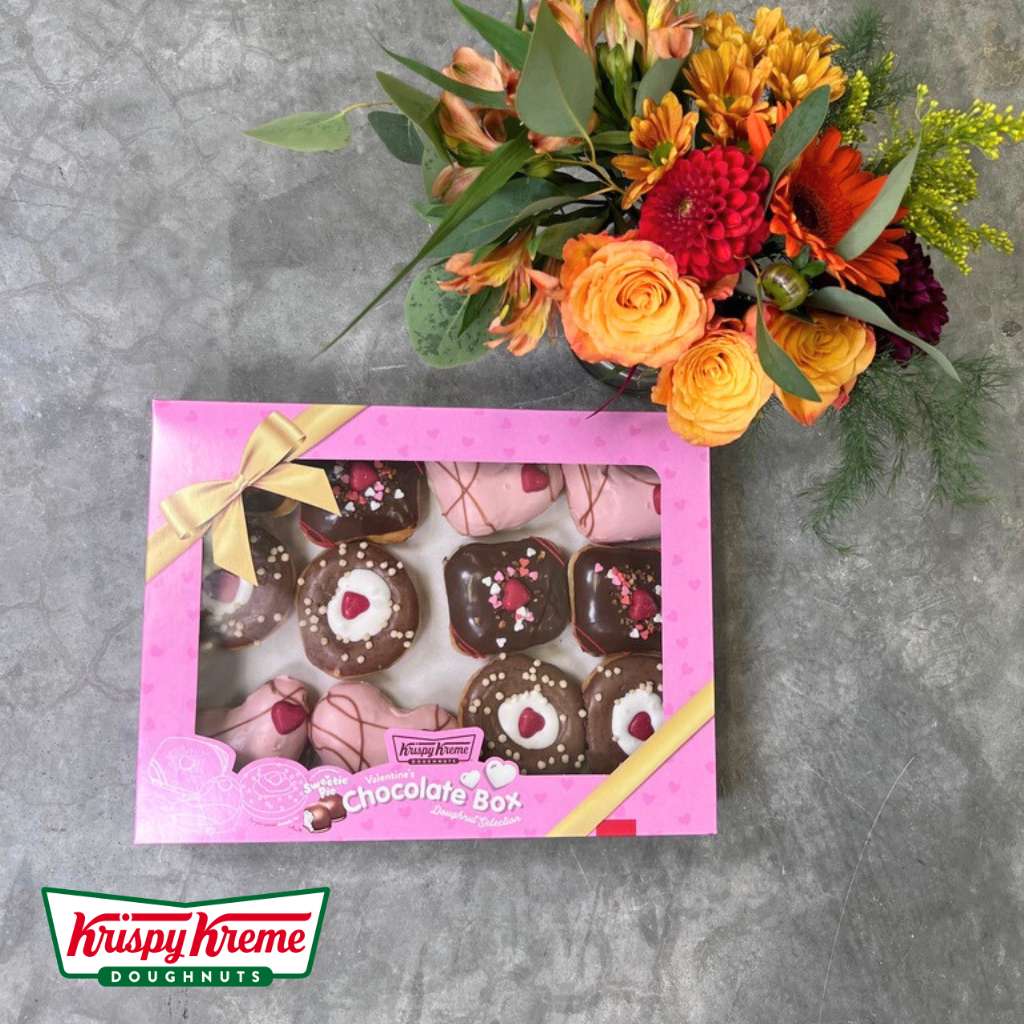 Flower Guy's Bottle Bouquet & Frosted Fancies featuring seasonal blooms and gourmet doughnuts.