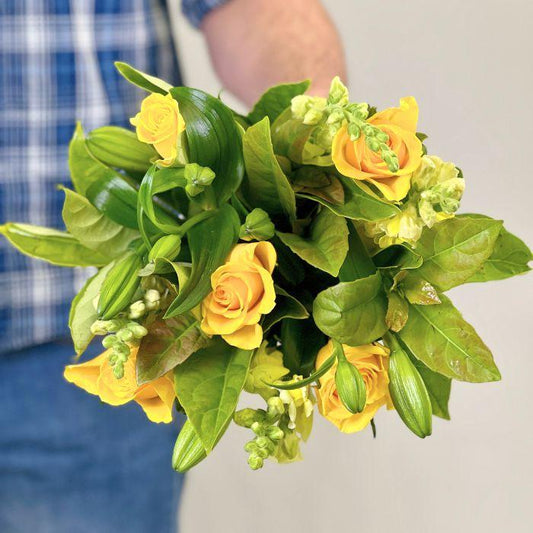 Yellow Rose, snapdragons and lilies in Citrus Sunshine Bouquet - Flower Guy