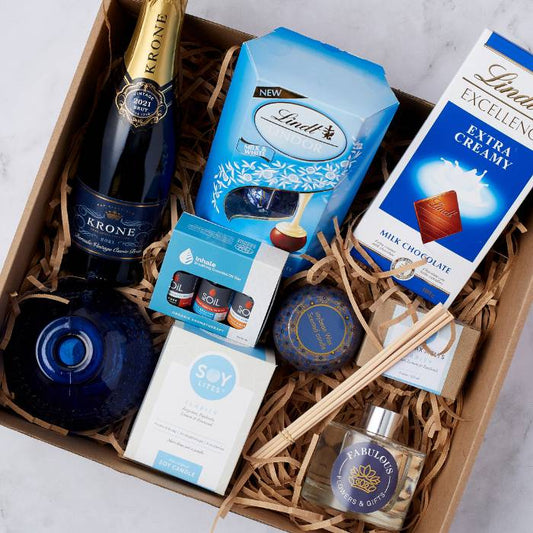 Luxurious Daydream Delight Gift Box featuring premium chocolates, aromatherapy oils, candle, and sparkling wine.