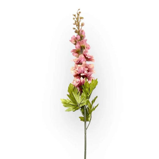 A single stem of dusty pink Delphinium artificial flower with green leaves against a white background, highlighting its detailed and lifelike appearance.