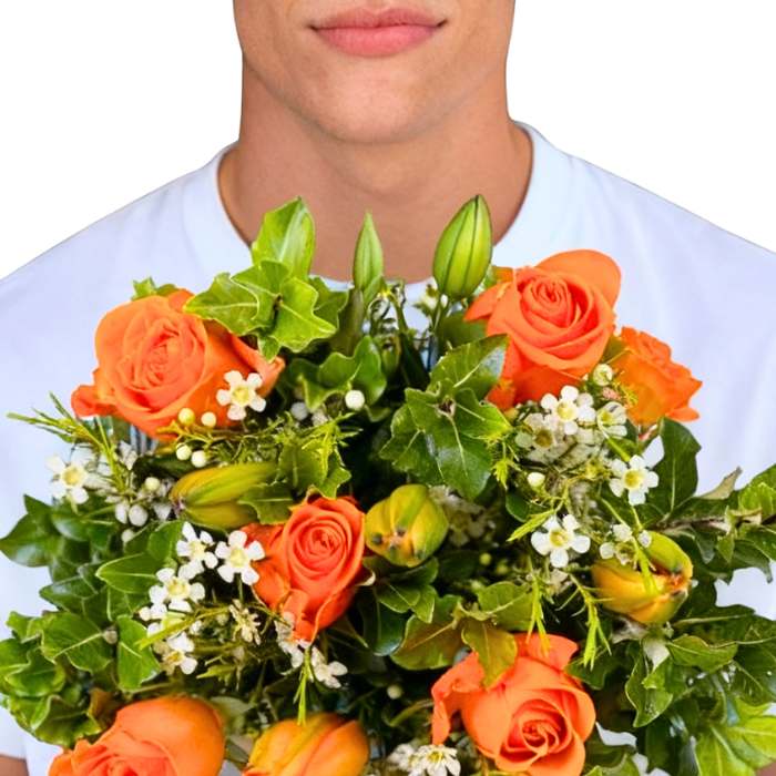 Orange Blossom Flower Bouquet close-up—orange roses with lilies, white waxflower and fresh greenery, gift-ready | Flower Guy