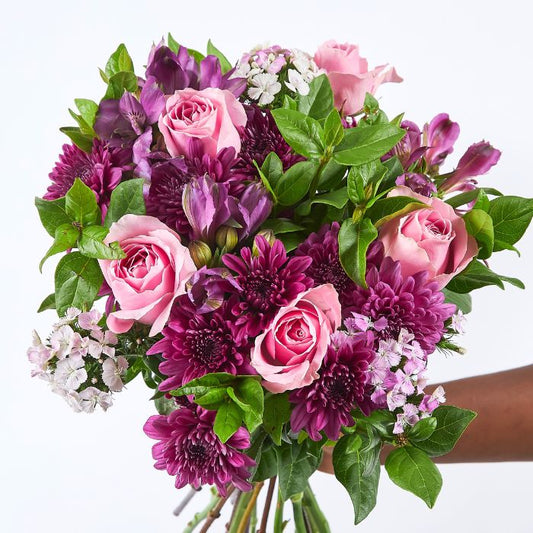 Elegant Spring Blossom Bouquet with pink and purple blooms, hand-tied and perfect for special occasions or heartfelt gifting.
