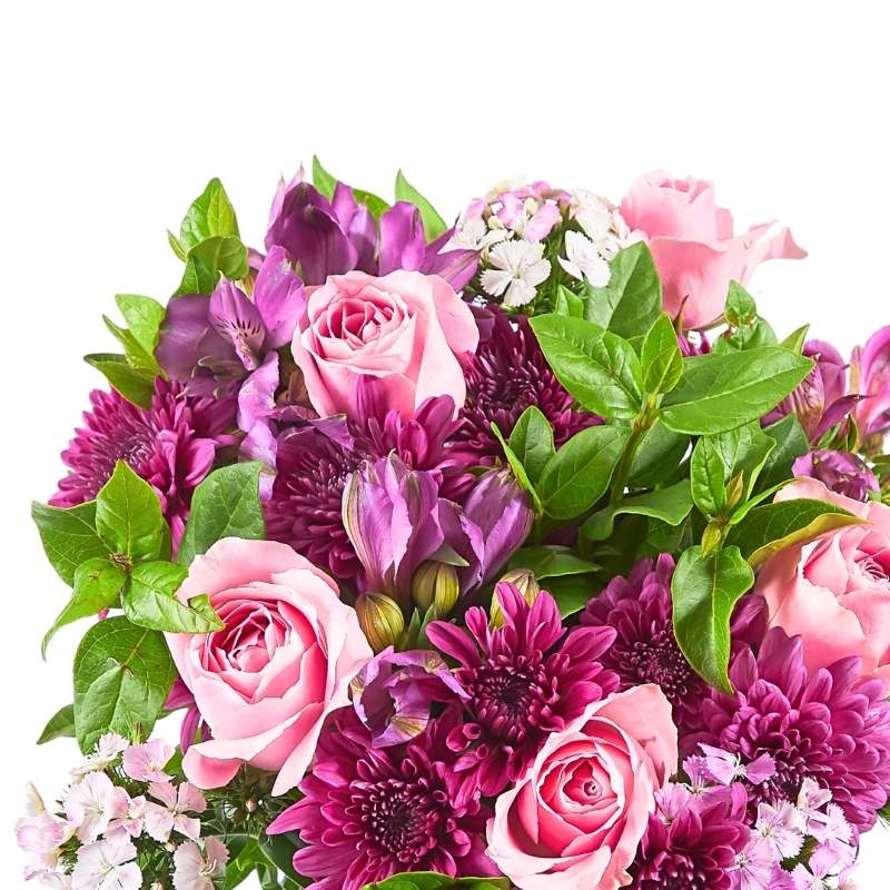 Spring Blossom bouquet close-up—pink roses, purple blooms and seasonal greenery in gift-ready wrap | Flower Guy