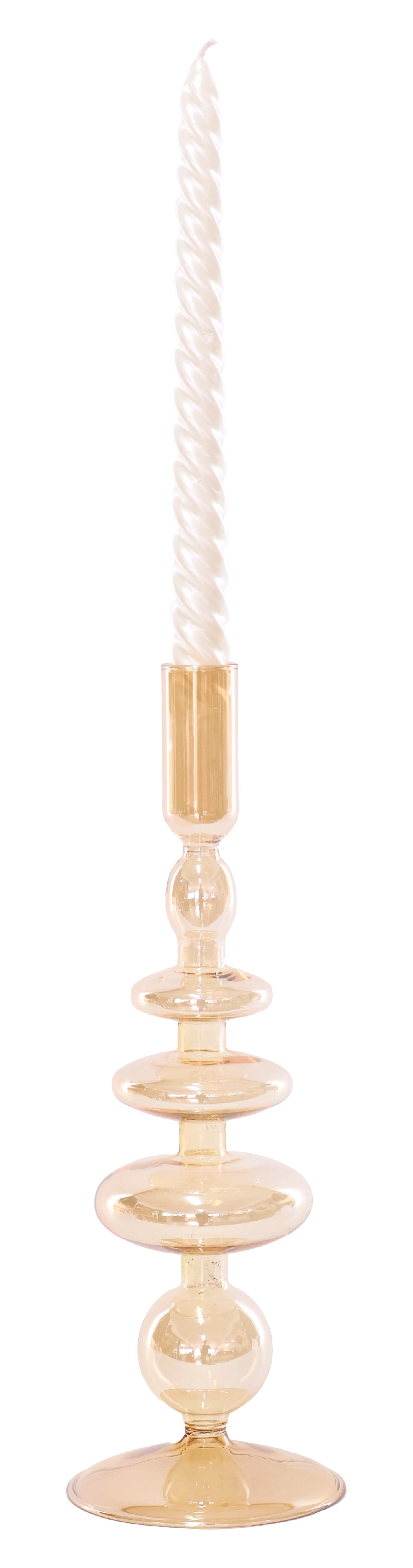 Decorative candle holder with a white candle on a white background