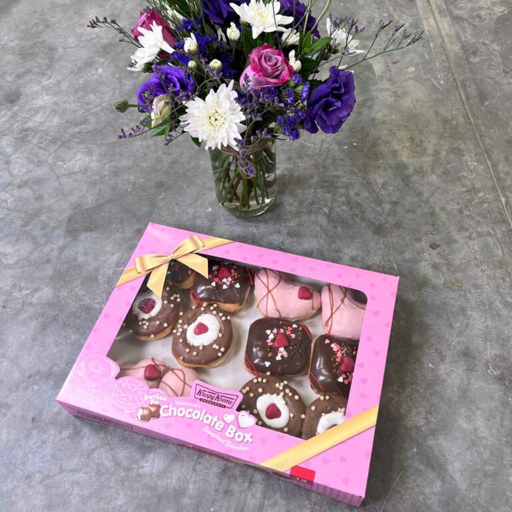 Flower Guy's Blossom Delight arrangement with Sweetie Pie™ Mallow and Choc Krispy Kreme doughnuts.