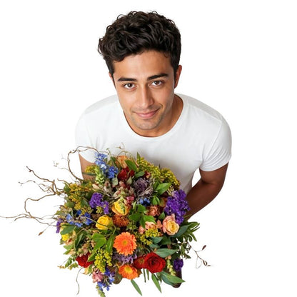 Brilliantly Happy Bouquet close-up—colourful mixed blooms with orange/red roses, purple statice and snapdragons | Flower Guy