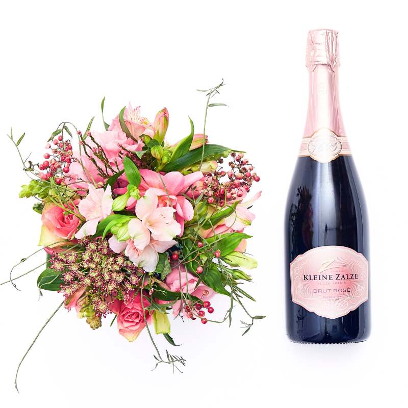 Bubbles and Pink gift set—pink floral arrangement with greenery beside a sparkling wine bottle, styled for celebration | Flower Guy