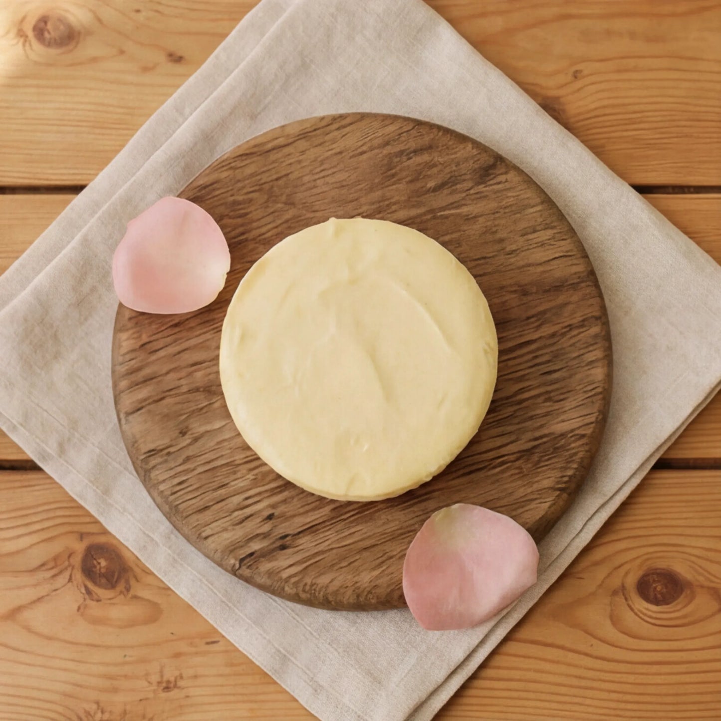 Top-down Lemon Cheesecake with pale lemon top and golden biscuit base, hand-made in Cape Town