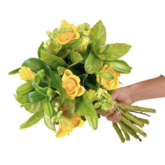 Citrus Sunshine Flower Bouquet—yellow roses and greenery hand-tied and held in hand | Flower Guy