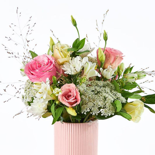 Dear Heart flower arrangement close-up in a modern pink vase with blush roses, white florals and soft greenery | Flower Guy
