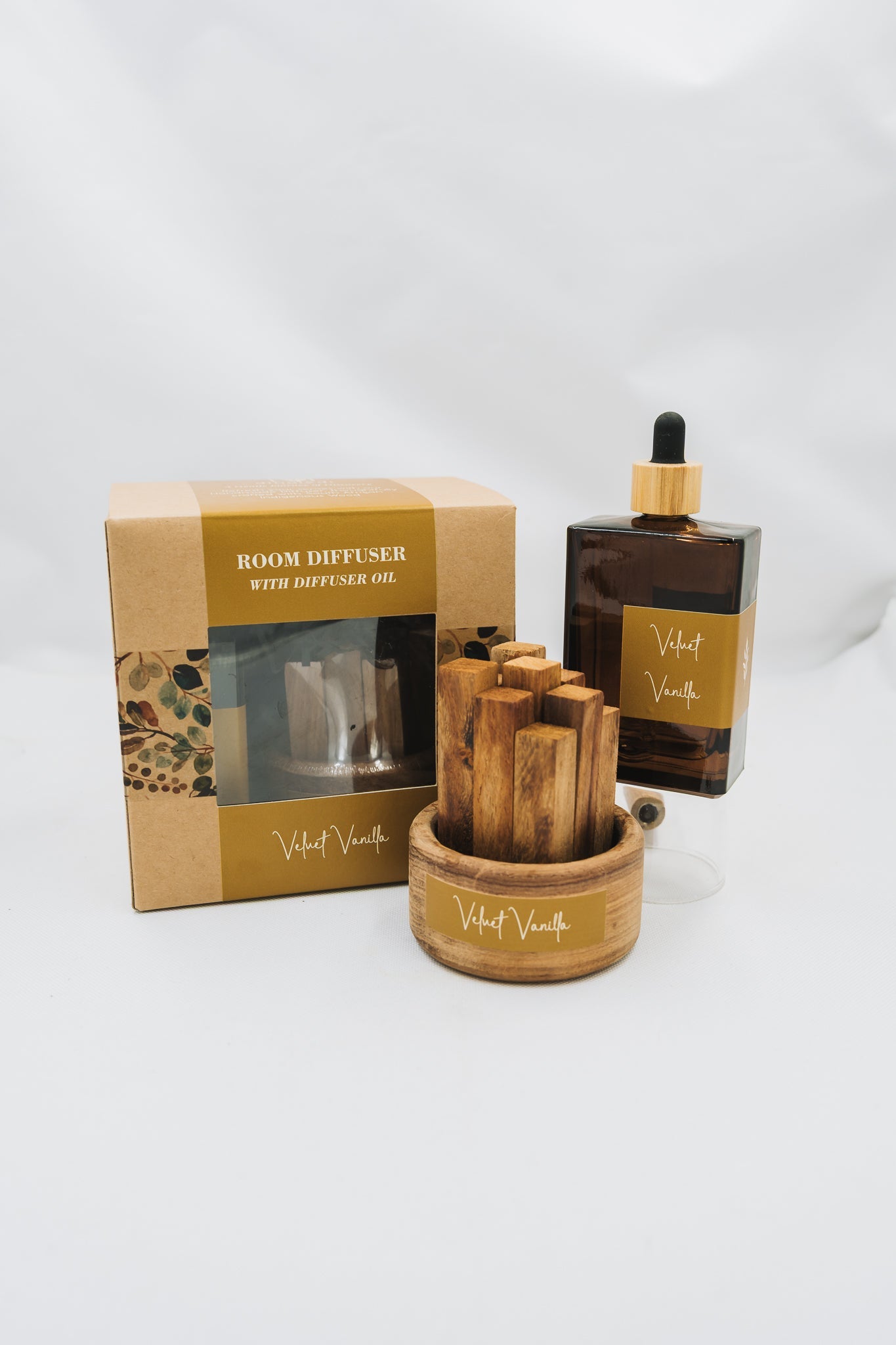 Wooden diffuser set with packaging on a white background