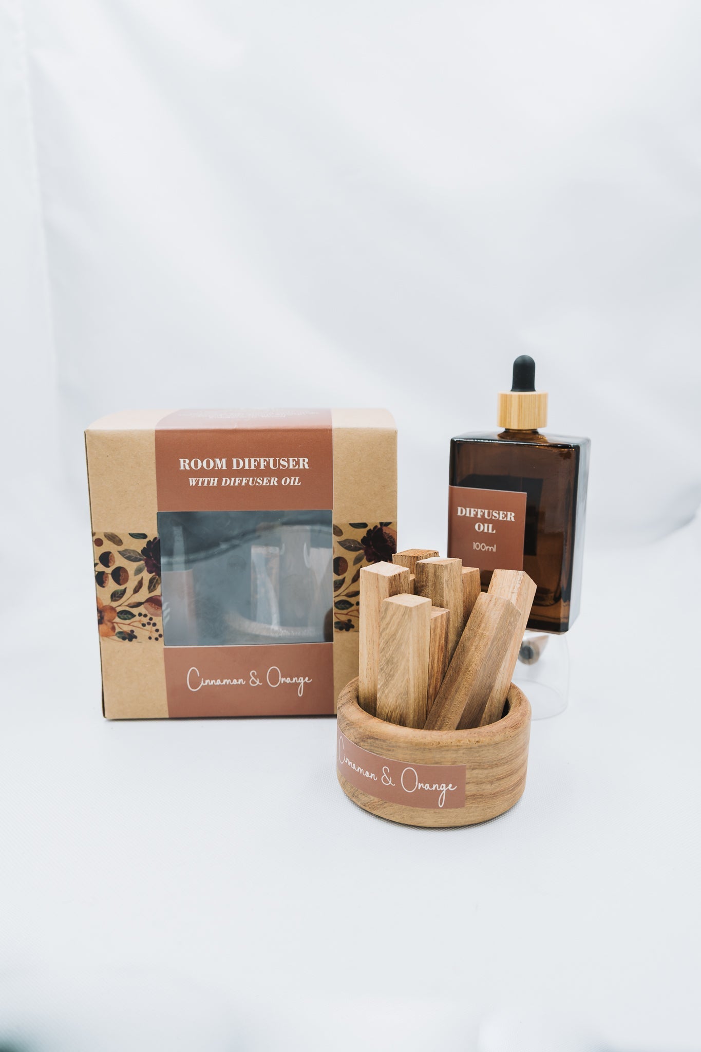 Room diffuser with diffuser oil and packaging on a white background
