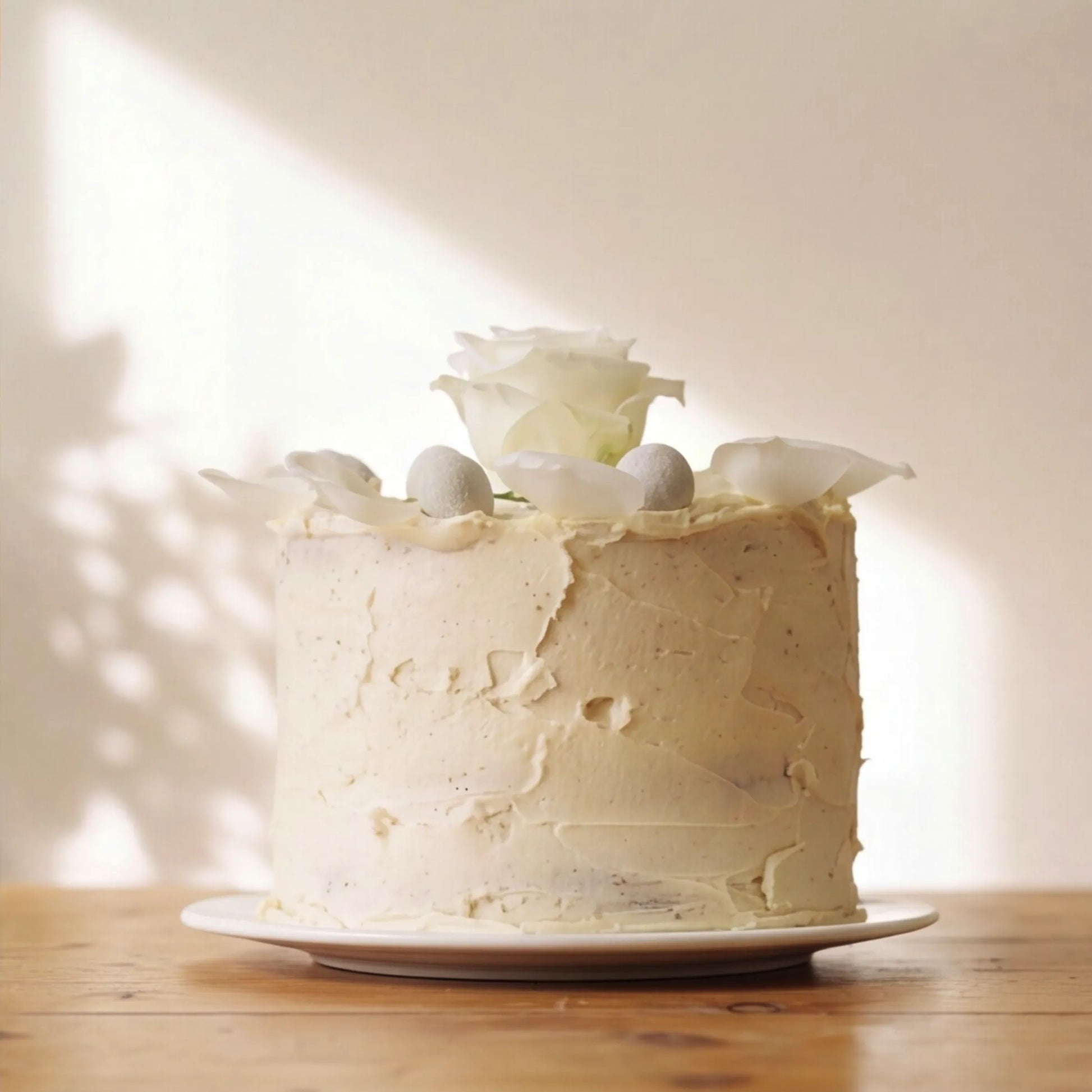 Side view of textured vanilla buttercream Elegant Rose Celebration Cake by Flower Guy Cape Town
