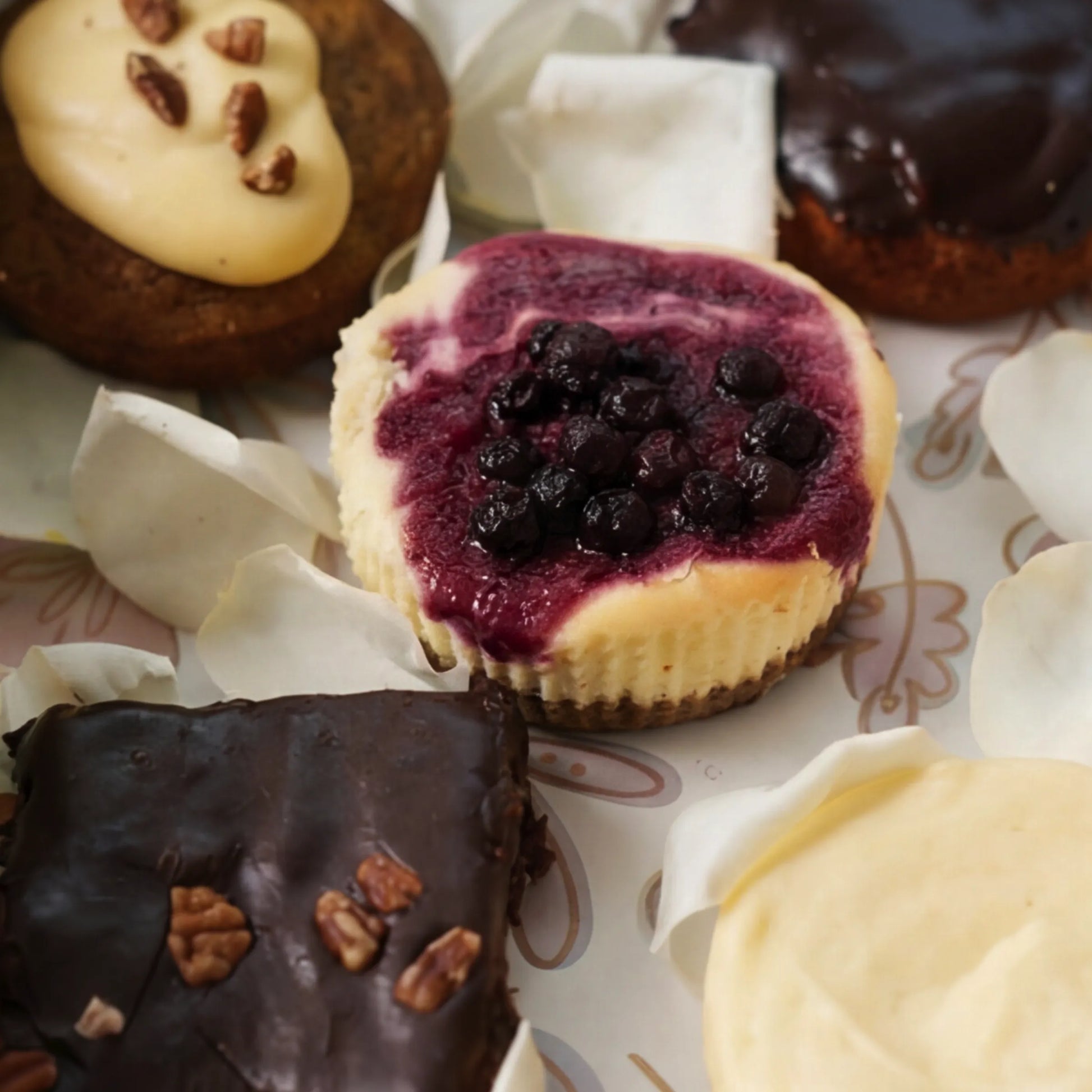 Close-up of blueberry cheesecake, carrot cake and brownie in From Me With Butter box, Cape Town