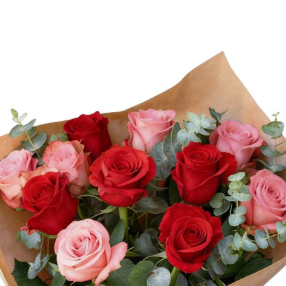 Nailed It rose bouquet close-up—red roses with blush accents and lush greenery in kraft wrap, gift-ready | Flower Guy
