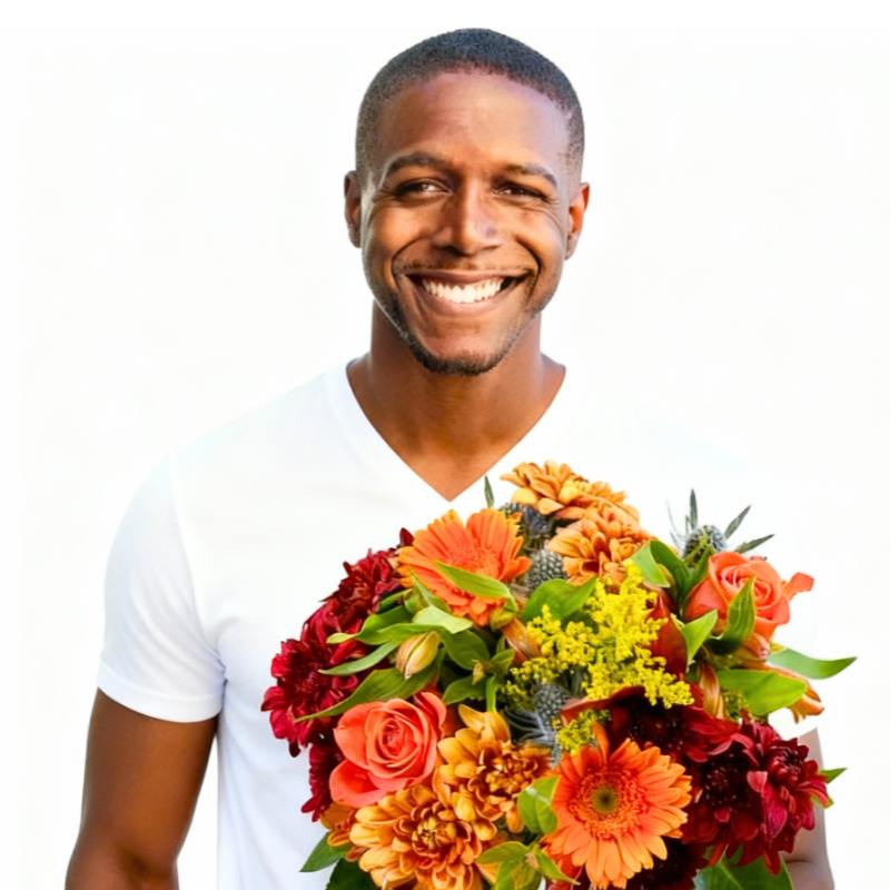 Namaqualand Nectar Flower Bouquet—man holding orange gerberas, roses and greenery, hand-tied and wrapped | Flower Guy