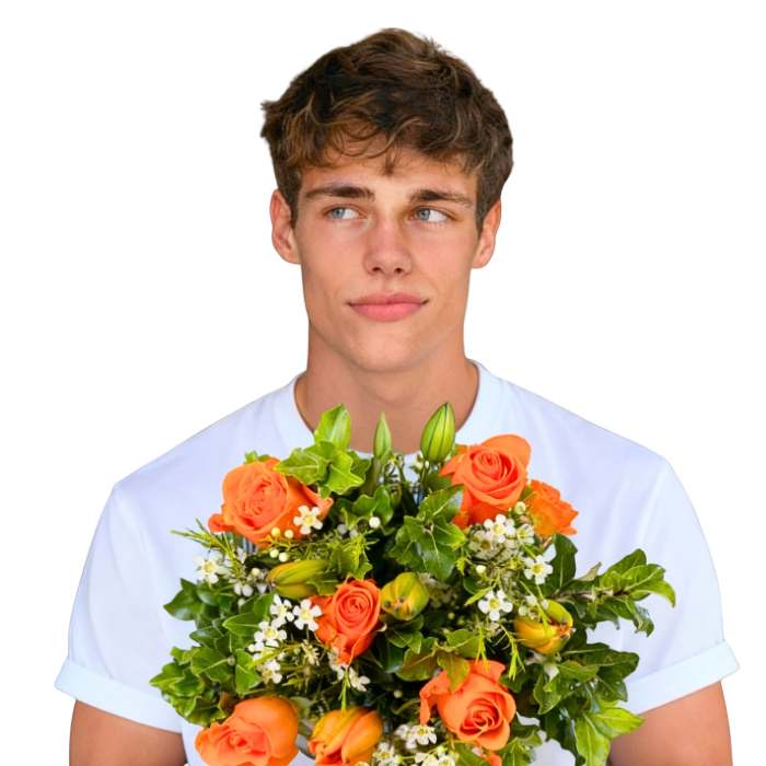 Orange Blossom Flower Bouquet—model holding orange roses, lilies and white waxflower with greenery, hand-tied | Flower Guy