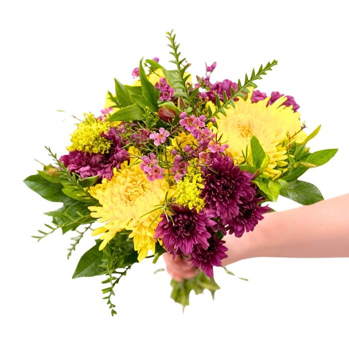 Peninsula Paradise Flower Bouquet—purple and yellow blooms with greenery, hand-tied and held in hand | Flower Guy