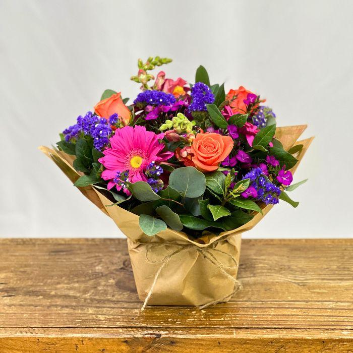Petal Palette Posy Bouquet with gerbera daisies, roses and more wrapped in eco-friendly kraft paper - Flower Guy