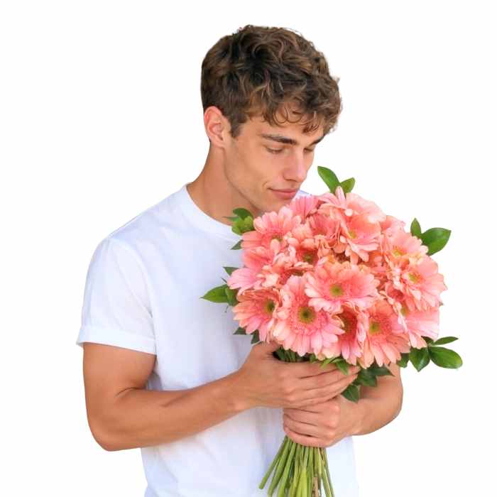 Pink-a-licious Daisy Dazzle Bouquet—model holding 20 pink gerbera daisies with greenery, hand-tied | Flower Guy