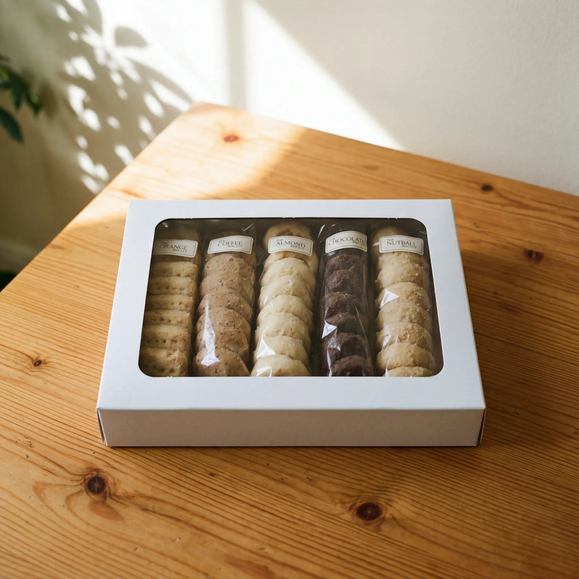 The Best Biscuits white gift box with viewing window showing all five biscuit flavours, ready for nationwide delivery