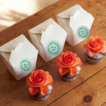 Three chocolate cupcakes with orange rose toppers paired with their individual Flower Guy gift boxes, Cape Town same-day cupcake add-on for sharing