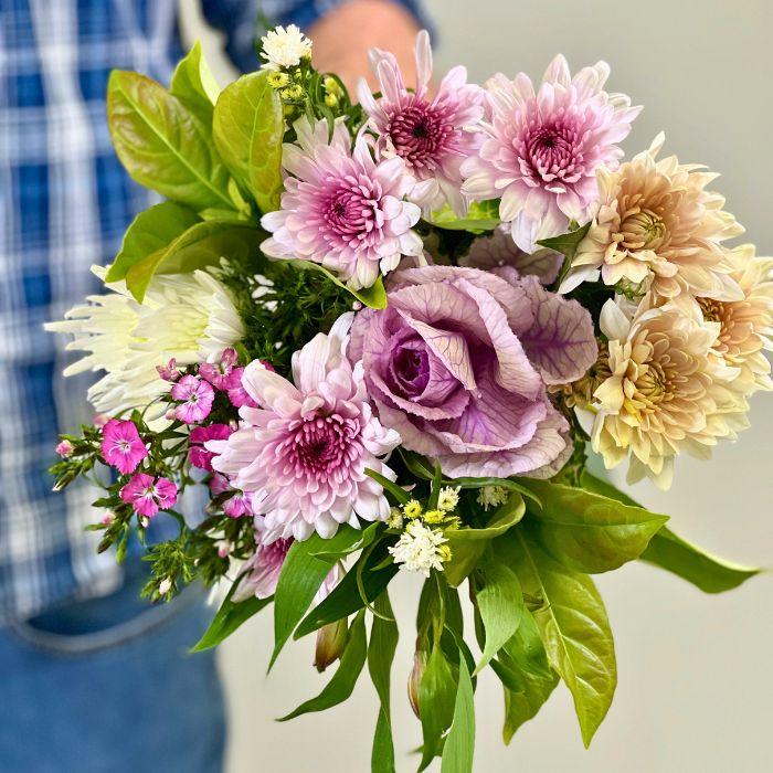 Close-up of Tsitsikamma Twilight Ornamental Kale Bouquet with lilac, cream and pink chrysanthemums, sweet william and greenery - Flower Guy